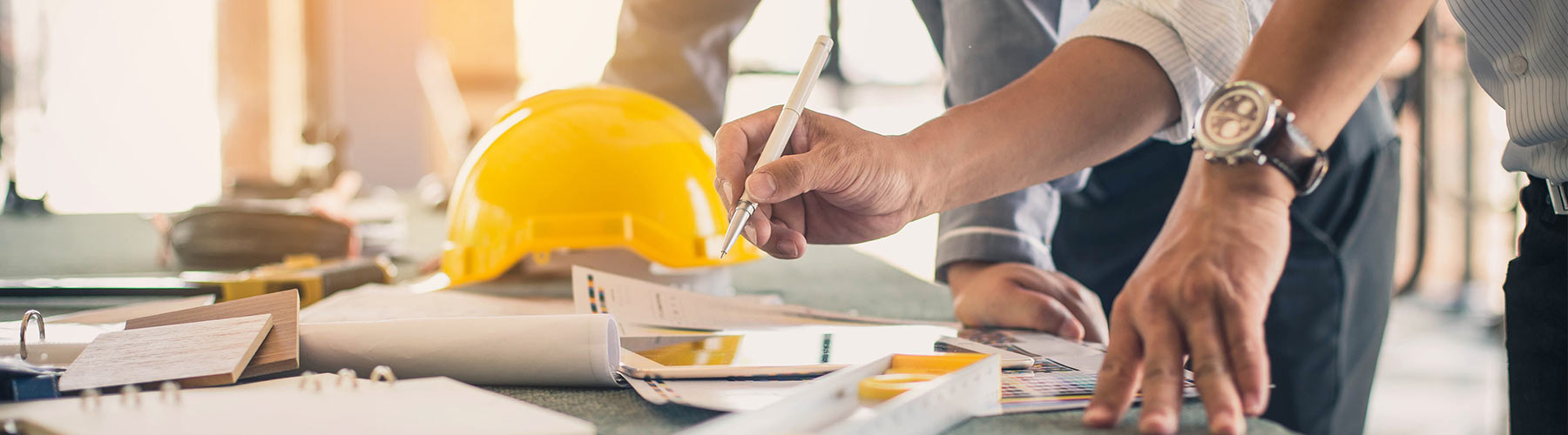 Group of workers looking over plans