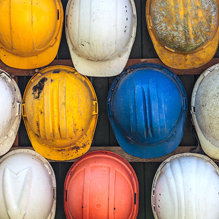 Hard Hats hanging on a wall